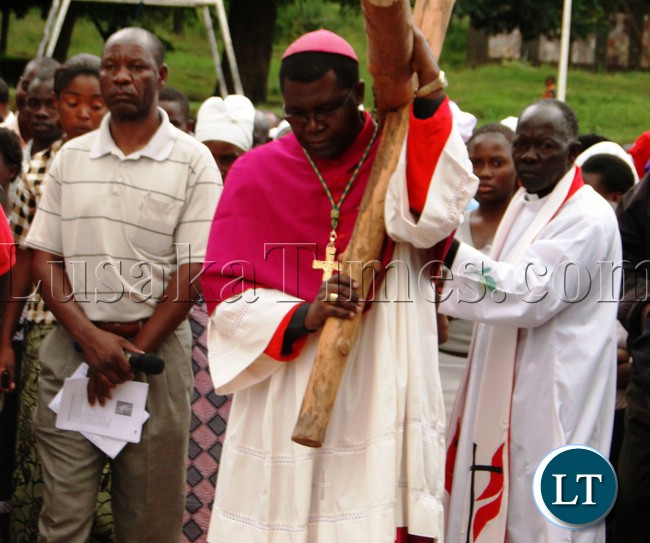 KASAMA Archbishop Ignatius Chama carrying the cross of Jesus Christ during Good Friday with several faithfuls at St. Johns Cathedral in Kasama KASAMA Archbishop Ignatius Chama carrying the cross of Jesus Christ during Good Friday with several faithfuls at St. Johns Cathedral in Kasama