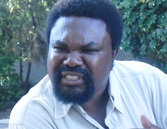 Dr Canisius Banda talking to journalists