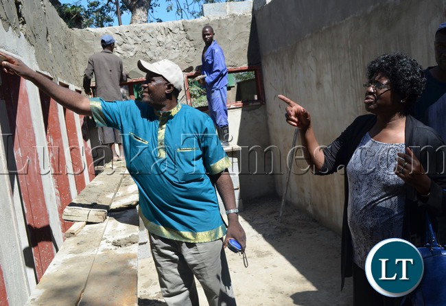Livingstone City Council administrator Alex Bwalya shows Tourism and Arts Permanent Secretary Charity Mwansa additional infrastructure under construction at world heritage site around Victoria Falls border