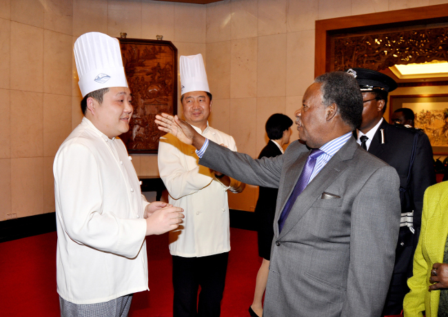 President Michael Sata bidding farewell Diayutai State Guest House staff shortly before departure from Beijing China to Lusaka on April 11,2013-Picture by THOMAS NSAMA