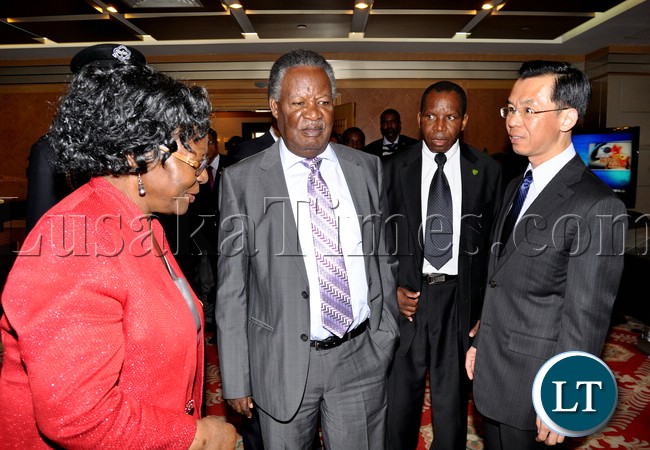 President Michael Sata with Ministry of Foreign Affairs-African department Director General Lu Shaye (c) nd Zambia's Ambassador to China Eva Fundafunda (l) at Beijing International Airport shortly before departure for Sanya in China on April 5,2013-Picture by THOMAS NSAMA