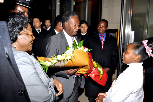 President Michael Sata with Zambia's Ambassador to China Eva Fundafunda and Saboi Sitwala (r) on arrival at Beijing International Airport