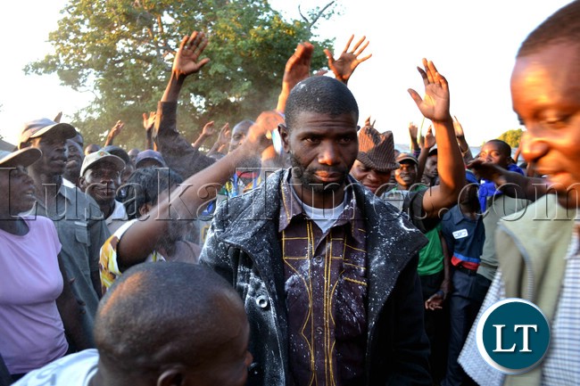 UPND candidate Misheck Mutelo is smeared with face powder after he was declared winner of the Lukulu West by-election at Mitete basic school