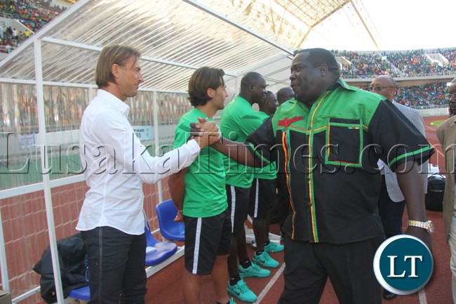 Sports Minister Chishimba Kambwili greets Zambia coach Herve Renard