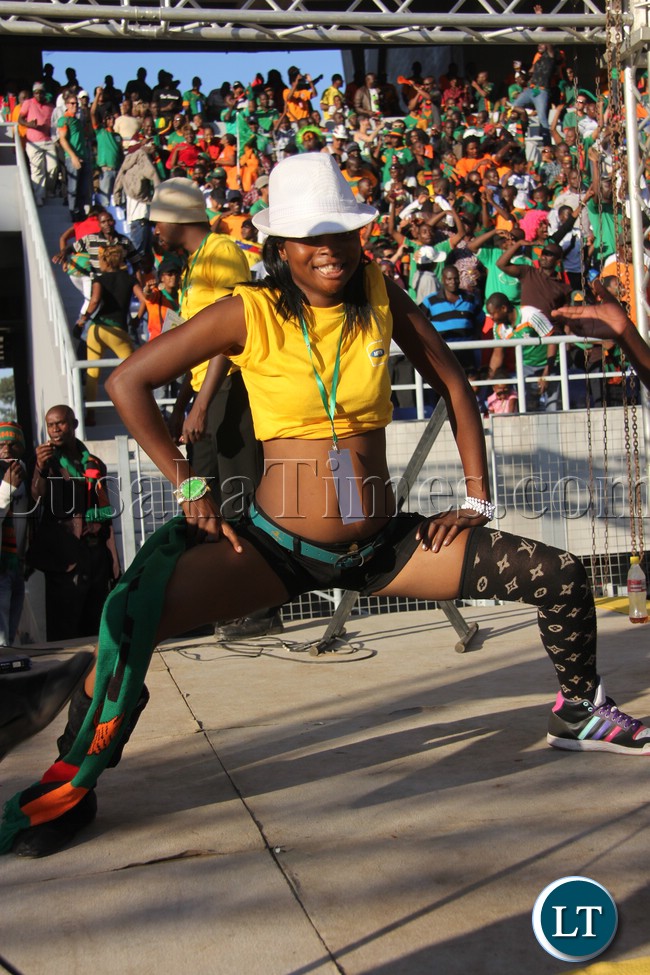 A chipolopolo fan showcasing her dancing skills during the Zambia/Lesotho game