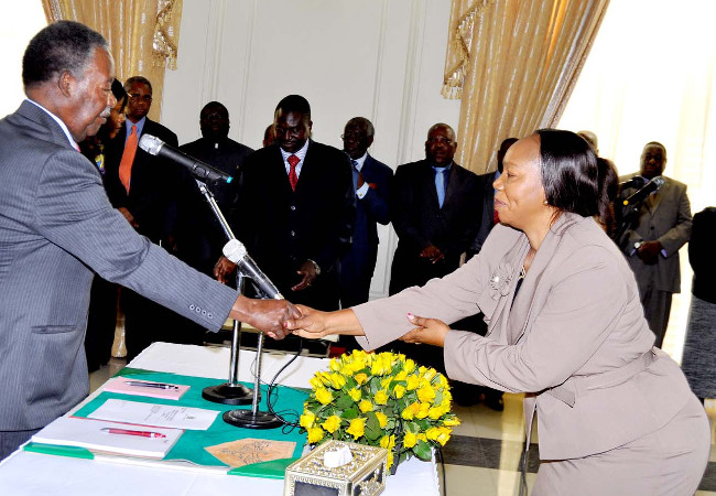 President Michael Chilufya Sata during the swearing-in-ceremony of Tranpor, Works, Supply and Communication permanent secretary Charity Kaande Ngoma at State House