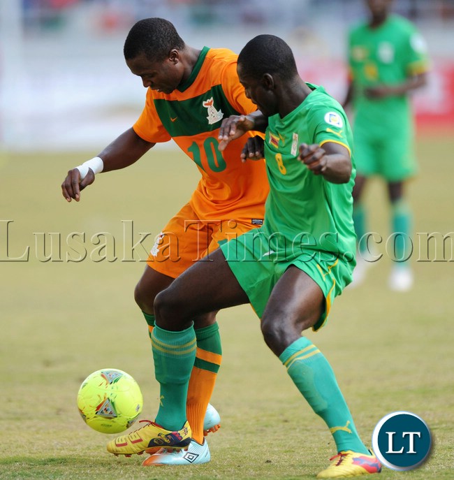 Football - 2013 Cosafa Cup - Final - Zimbabwe v Zambia - Levy Mwanawasa Stadium - Zambia Bornwell Mwape of Zambia challenged by Eric Chipeta of Zimbabwe during the Cosafa Cup Final Match mach between Zimbabwe and Zambia on the 20 July 2013 at Levy Mwanawasa Stadium, Zambia ©Muzi Ntombela/BackpagePix