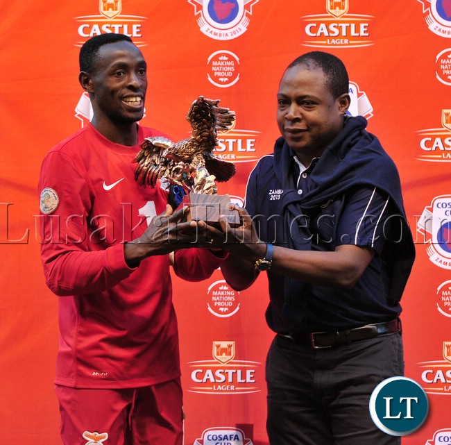 Danny Munyau of Zambia receives a goal keeper of the tournament from Kalusha Bwalya, President of FAZ during the Cosafa Cup Final Match mach between Zimbabwe and Zambia on the 20 July 2013 at Levy Mwanawasa Stadium, Zambia ©Muzi Ntombela/BackpagePix