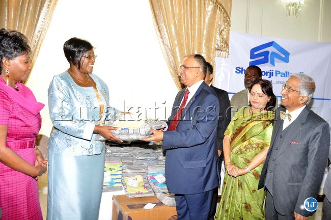 FILE: First Lady Dr Christine Kaseba receives a donation of 3000 blankets and 3000 sweaters from Iyer Kuppuswamy,SP group of companies advisor.The donation is in fulfillment of the wish of a 16 year old daughter of the owner of the Indian owned company who wants to help vulnerable children in Africa.