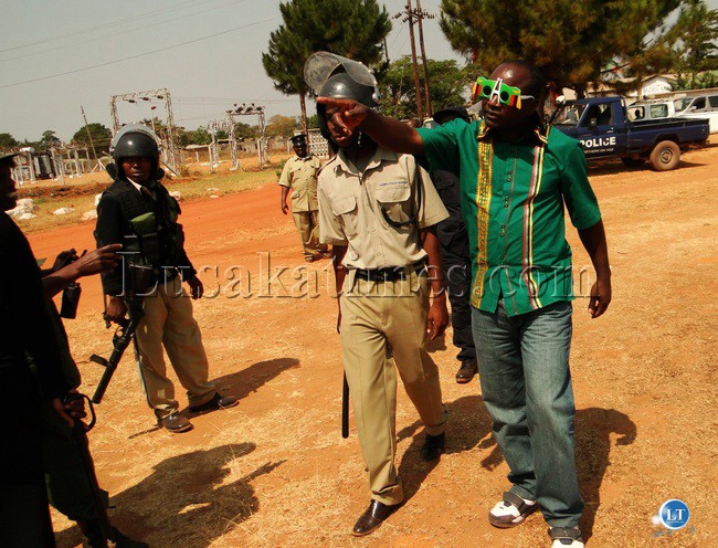 A furious Patriotic Front (PF) cadre demanding that the vehicle of National Redemption Party (NAREP) President Elias Chipimo (not in the picture) not to be allowed to enter Radio Mano Community station in Kasama