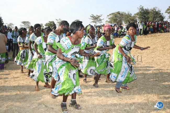 SOME Patriotic Front party women entertain the crowd at Nyakutwa Basic School in Chipata Central constituency before Vice President, Dr. Guy Scott, addressed a rally to drum up support for the party candidate, Lameck Mangani, last Saturday.