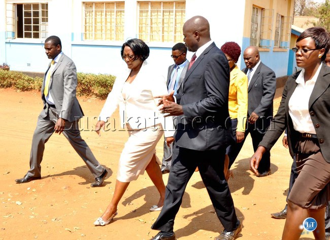 First Lady Dr Christine Kaseba flanked by David Kaunda Technical High School deputy Head Teddy Chibwe during tour of the school where she gave a Lecture to pupils and Youths under the theme: " Young People are Key agents in the fight against cancer." in Lusaka