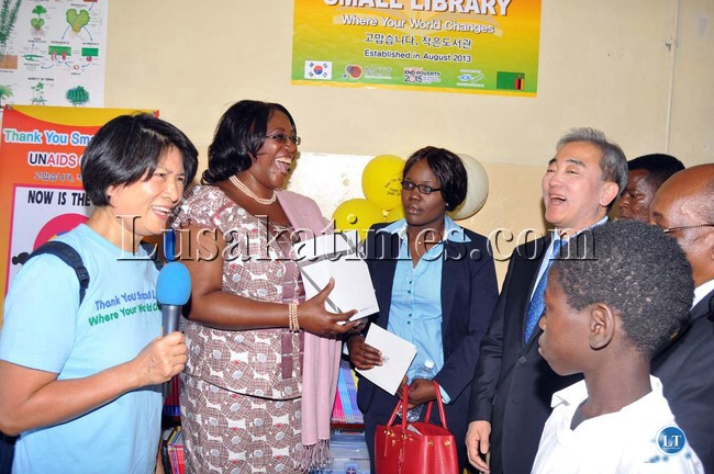 First Lady Dr Christine Kaseba and Minister of Culture,Sport and Tourism of the Republic of Korea Yoo Jinr Yong and UN MDG Advocate Dho Young Shim (l) share a light moment during the handover of STEPS Libraries and Library equipment donated by Korean STEEP S Foundation at Dambwa Primary school in Livingstone on August 28,2013 -Picture and caption by THOMAS NSAMA
