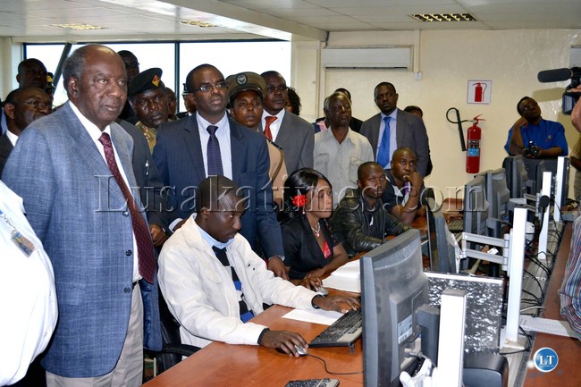 Finance Minister Alexander Chikwanda inspects the electronic traffic management system when he visited Kasumbalesa border post recently
