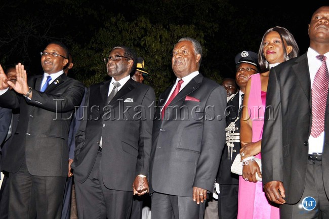 Zimbabwean Minister of Tourism Mzembi (l) President Michael Sata and Zimbabwean President Robert Mugabe and Zambia's Tourism minister Sylvia Masebo during the official opening of the 20th Session of the UNWTO General Assembly at Victoria Falls Hotel in Zimbabwe on August 25,2013 -Picture and caption by THOMAS NSAMA