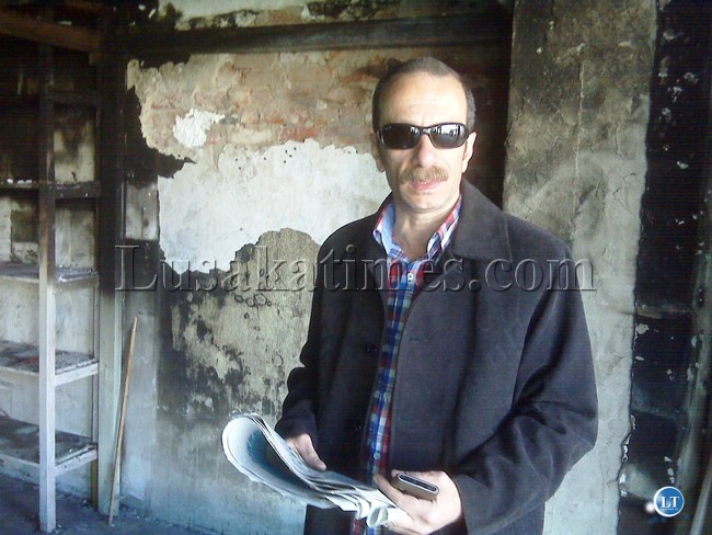DERGHAM Enterprises Limited proprietor Khaled Gaballa at the entrance of his gutted shop in Kamwala.He said the fire was caused by a short circuit arising from ZESCO works in the area earlier in the day which had resulted in power disconnection the whole day.