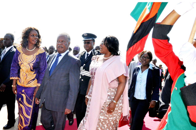 President Michael Sata with First Lady Dr Chrstine Kaseba and Tourism minister Sylvia Masebo on arrival at Harry Mwaanga Nkumbula International Airport for the closing of the 20th Session of the UNWTO General Assembly August 28,2013 -Picture by THOMAS NSAMA