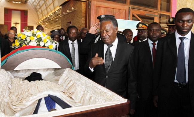 President Micheal sata views the Body of Late BY Mwila in Lusaka