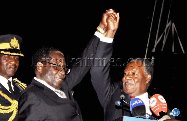 President Michael Sata and Zimbabwean President Robert Mugabe during the official opening of the 20th Session of the UNWTO General Assembly at Victoria Falls Hotel in Zimbabwe on August 25,2013 -Picture and caption by THOMAS NSAMA