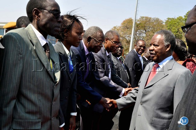 President Michael Sata bids farewell to Health Minister Dr Joseph Kasonde shortly before departure for Lusaka at Harry Mwaanga Nkumbula Airport on August 26,2013. This was after the official opening of the 20th Session of the UNWTO General Assembly which took place at Victoria Falls Hotel in Zimbabwe on August 25; 2013 -Picture and caption by THOMAS NSAMA
