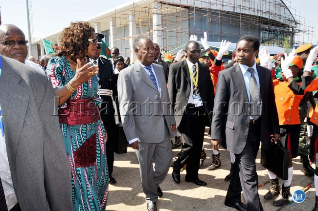 President Michael Sata with Sylvia Masebo on arrival at Harry Mwaanga Nkumbula International Airport for the opening of the UNWTO 20th General Assembly in Livingstone. Looking on are Vice-President's Spouse and Southern Province minister Daniel Mukombwe -Picture and caption by THOMAS NSAMA