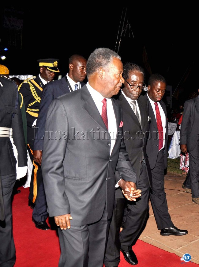 President Michael Sata and Zimbabwean President Robert Mugabe during the official opening of the 20th Session of the UNWTO General Assembly at Victoria Falls Hotel in Zimbabwe on August 25,2013 -Picture and caption by THOMAS NSAMA