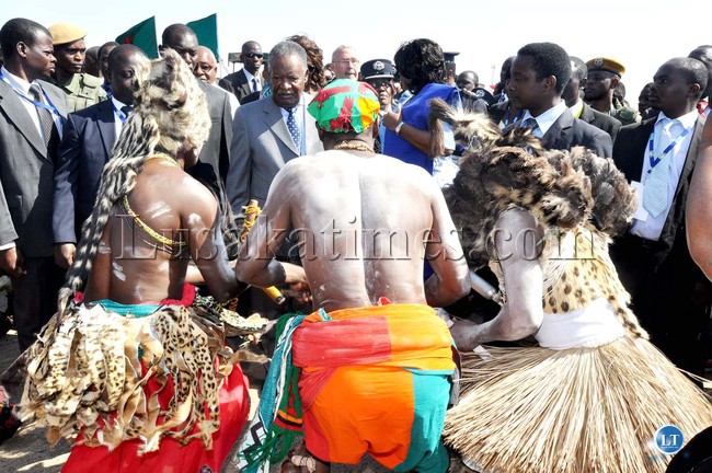 President Michael Sata watching traditional dancers on Arrival at Harry Mwaanga Nkumbula International Airport for the opening of the UNWTO 20th General Assembly -Picture and caption by THOMAS NSAMA