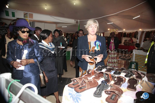 Wife of Vice President Guy Scott, Charlotte, tours various stands in the Jubilee Hall at the Zambia Agriculture and Commercial Show in Lusaka.