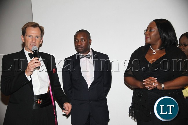First Quantum Minerals Ltd Zambia government Affairs John Gladston (l) talks as the First Lady Dr. Christine Kaseba (r) and Maysen and Borowski Group Manager Charles Kamwi listen during the Dinner Reception for UTH in partnership with Health Hope for Zambia at Intercontinental in Lusaka