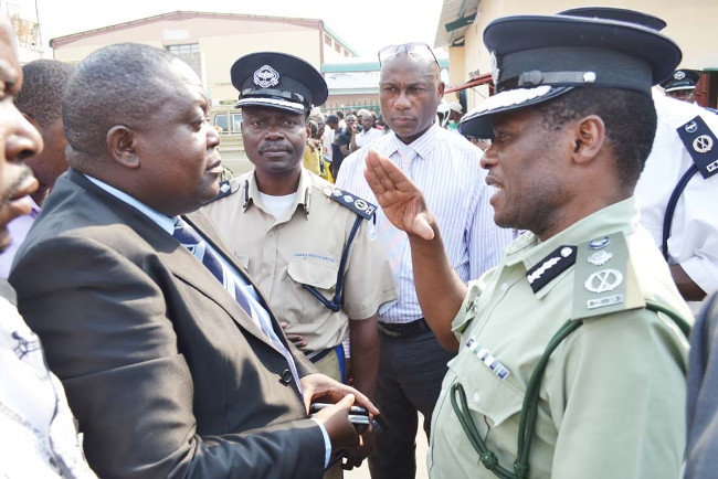 DEPUTY Inspector-General of Police Solomon Jere (right) talks to newly-appointed Patriotic Front (PF) interim District chairperson Robert Chikwelete at the ruling party’s District office premises DEPUTY Inspector-General of Police Solomon Jere (right) talks to newly-appointed Patriotic Front (PF) interim District chairperson Robert Chikwelete at the ruling party’s District office premises