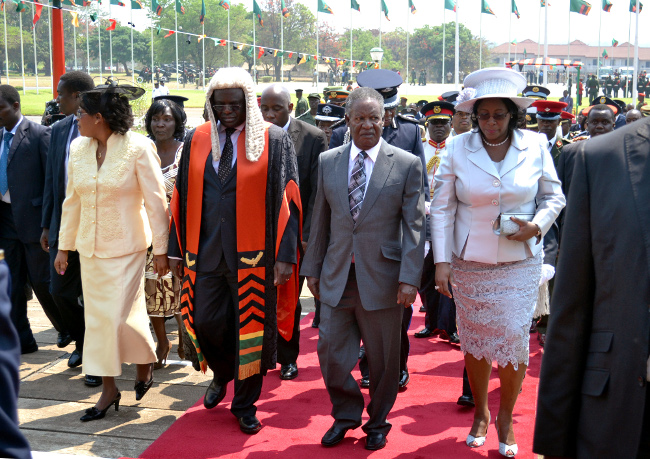 President Michael Sata, First Lady Dr Christine Kaseba, Speaker of the National Assembly Patrick Matibini and Mrs Matibini walks towards Parliament buildings at the official opening of the House in Lusaka