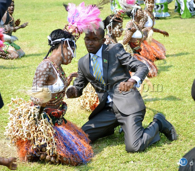 New Revolution Party leader Cosmo Mumba joins in a traditional dance at Parliament grounds