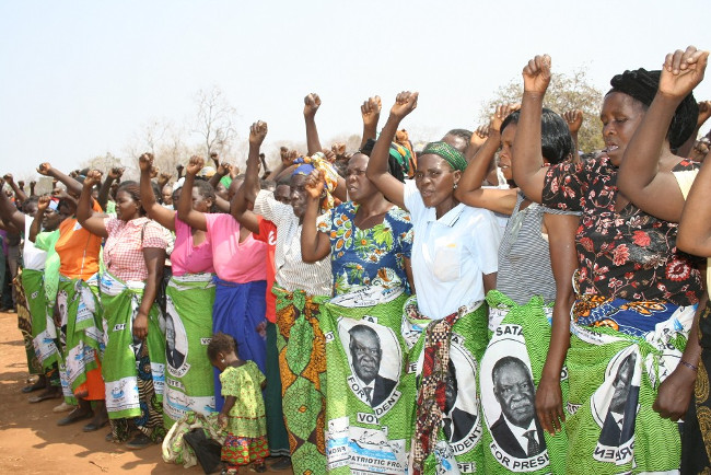 SOME Patriotic Front women sing the National Anthem during a rally addressed by President Michael Sata at Chimutende Primary School in Mkaika constituency