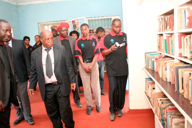 Zambia Library Service Chief Librarian Bwato Robinson (l) shows Education Minister Dr. John Phiri (c) the Mongu Libraryduring the Launch of the National Libraries Week at Mongu Librabry in Mongu