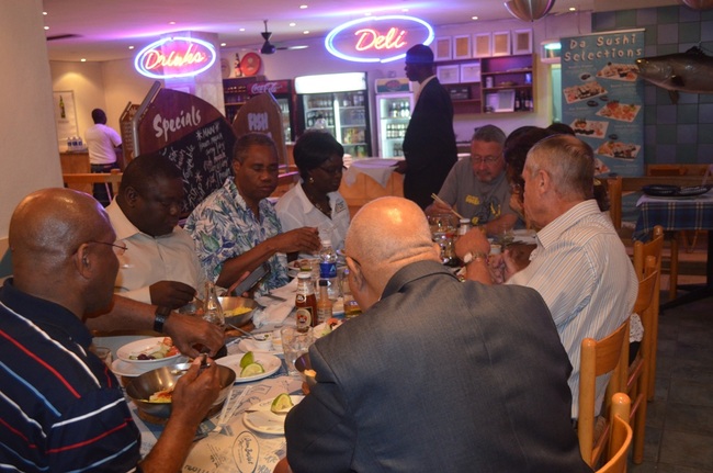 Vice President Guy Scott (sited on far right), some cabinet ministers and officials enjoying dinner at Ocean Basket in Livingstone during the UNWTO