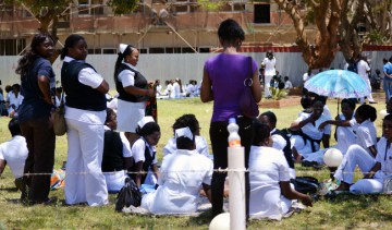 Protesting nurses at the University Teaching Hospital in Lusaka relax under a tree shade.