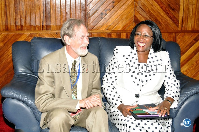 First Lady Dr Christine Kaseba welcomed by CDC's Dr Lawrence Marum shortly before they chaired a discussion on PMTCT services and community support for paediatric care and treatment. This was during the Third National HIV Prevention Convention 2013 at Mulungushi International Conference Centre on November 7,2013 -Picture by THOMAS NSAMA