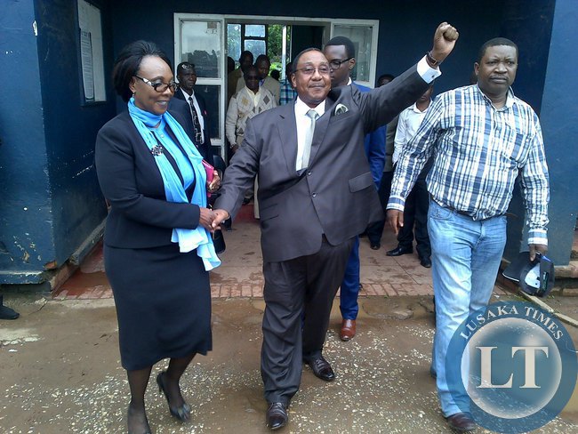 Former defence minister Geoffrey Mwamba and his wife at woodlands police station