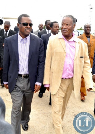 President Sata flanked by Justice minister Wynter Kabimba on arrival at Kenneth Kaunda International Airport