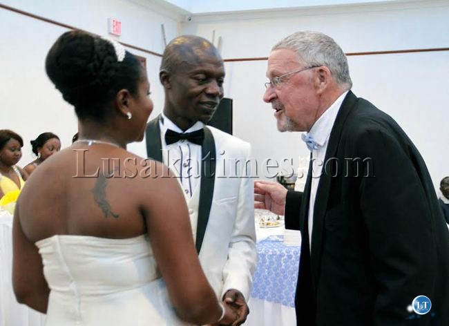 Vice President Guy Scott (right) talks to President Micahel Sata's son Kazimu (centre) and his wife Tiwonge Mukobeko during their wedding reception in Lusaka over the weekend.