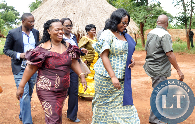 First Lady Dr Christine Kaseba with Chiefs and Traditional affairs minister Prof Nkandu Luo (l) and Southern Province minister Daniel Munkombwe leaves after a discussion with Headmen and Community Leaders in curbing gender based violence at Chief Chikanta's palace in Kalomo District