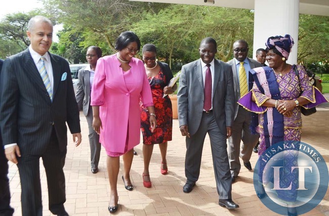 FIRST Lady Christine Kaseba-Sata (second from left) shares a light moment with Taj Pamodzi Hotel general manager Sanjay Sood (left), Palliative Care Alliance Zambia (PCAZ) board chairperson Fastone Goma (third from left) and PCAZ vice chairperson Lister Chingangu (far right) in Lusaka yesterday. This was when Dr Kaseba was arriving to officiate at the PCAZ stakeholders strategic engagement meeting.