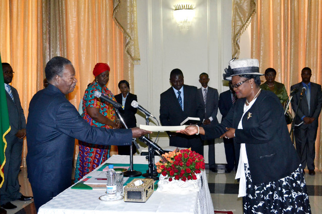 President Michael Sata receives an affidavit from newly appointed Community Development Mother and Child Deputy Minister Ingrid Mpande at State House