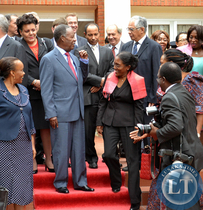 President Michael Sata shares a light moment with heads of diplomatic missions accredited to Zambia after a closed door meeting at State House in Lusaka