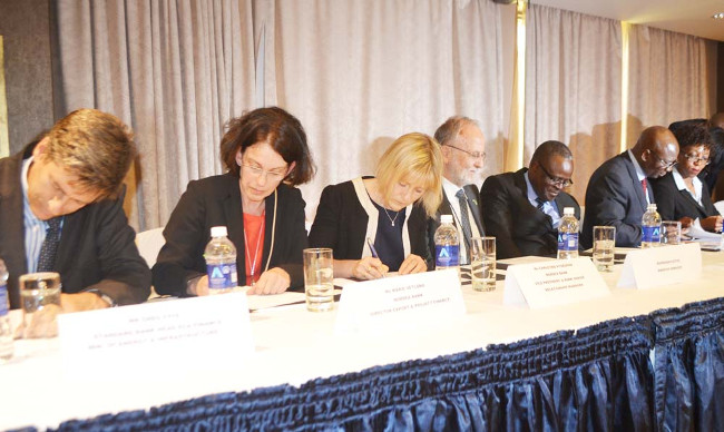 ZESCO managing director Cyprian Chitundu (second from right), Energy Deputy Minister Charles Zulu (third from right), Swedish Embassy first secretary Lars Karlsson, Nordea Bank vice president and senior relationship manager Christina Rydegran, Nordea Bank export and project finance director Marie Vetland and Standard Bank of South Africa head of Export Credit Agency and cross-border finance Greg Fyfe. This was during the signing of US $163 million loan agreement between ZESCO and the two banks in Lusaka