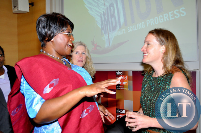First Lady Dr Christine Kaseba speaks with Mulago Foundation Associate Portfolio Director Kristin Gilliss (r) after a discussion on the Impact Jackpot: Service delivery Innovation for the very poor . This was during the Skoll World Forum on Social Entrepreneurship at Oxford University in UK on April 11,2014 -Picture by THOMAS NSAMA