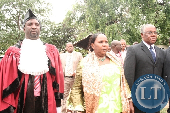 Mongu Central MP Nathaniel Mubukwanu (r) and Western Province Minister Josephine Limataa (c) escort Mongu Municipal Council Mayor Elect Tombi Tombi (l) to his office during the Mayoral Inauguration Ceremony at Civic Center in Mongu District, Western Province