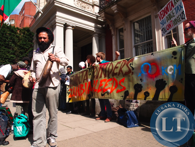 Protestors from various organisations demanding KCM published profits and taxes