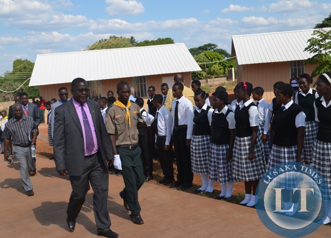 Southern Province senior education standards officer in charge of special education Benson Zemba (middle) inspects a guard of honor mounted for him by Terry Schwartz SDA Secondary School as Zambia Union Conference president Harrington Akombwa (behind Mr Zemba) follow.This was in Livingstone on Wednesday afternoon during the official launch of Terry Schwartz SDA Secondary School
