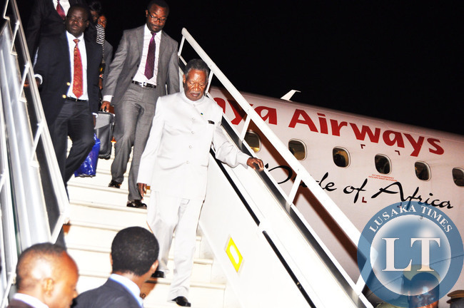 President Michael Sata disembarks from Kenya Airways Plane